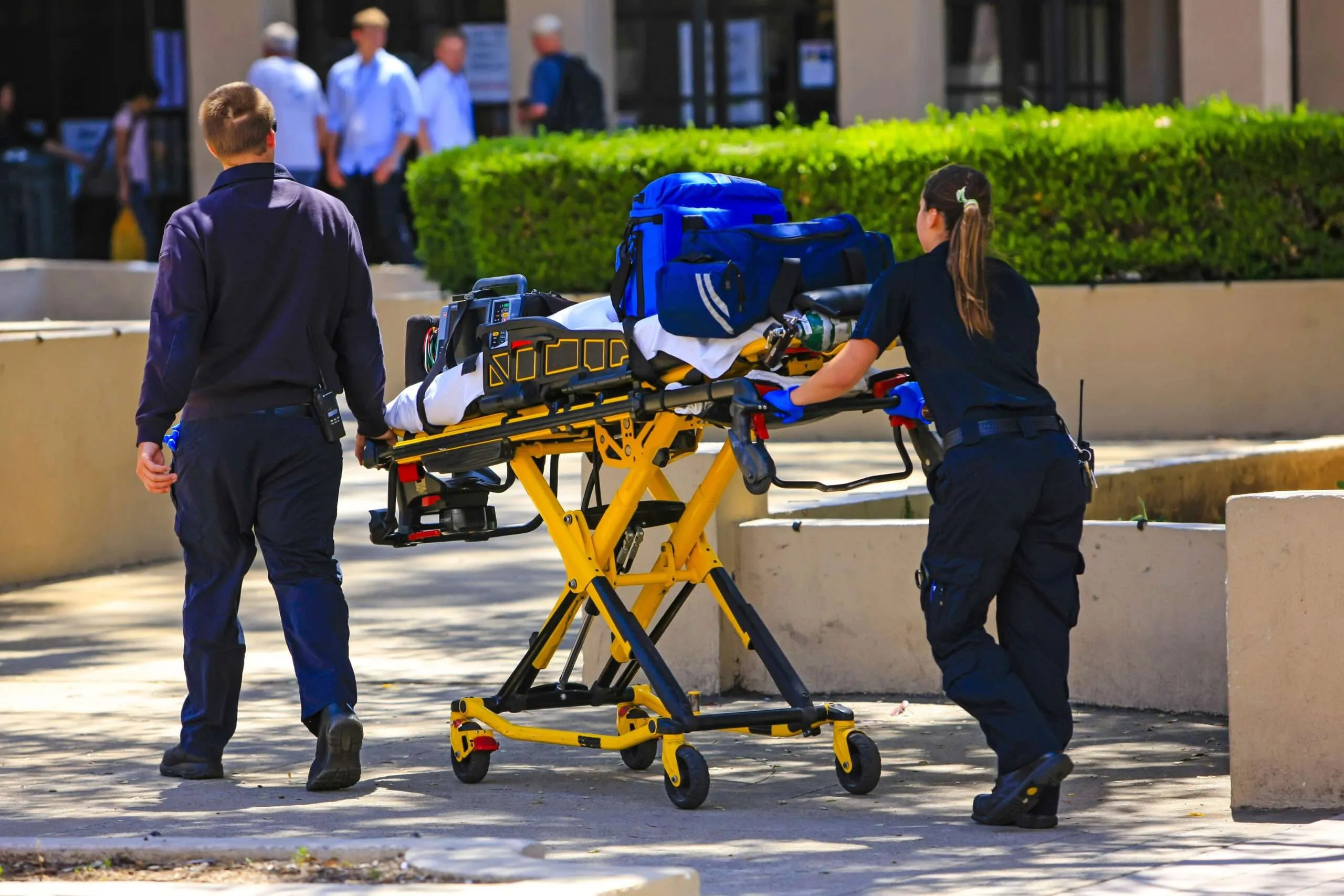 Paramedics pushing a gurny loaded with life saving equipment in Santa Barbara CA, USA USE THIS ONE
